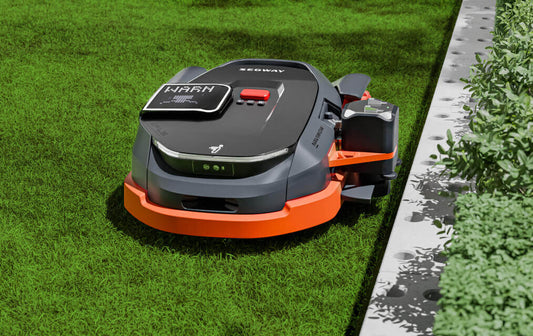 Segway Navimow X3 robotic lawn mower navigating a well-maintained grass lawn, featuring modern design and easy operation.