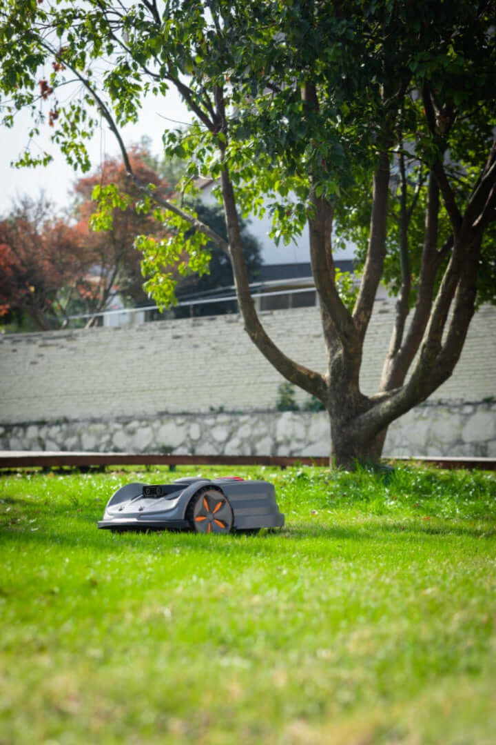 SunSeeker Orion X7 robotic lawn mower navigating a green lawn, showcasing advanced autonomous mowing technology.